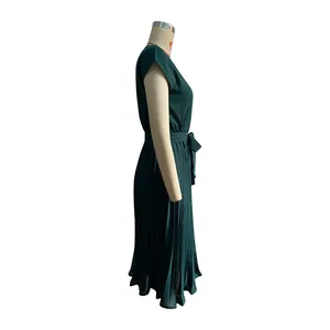 Side view of dark green pleated short sleeve dress with adjustable waist tie