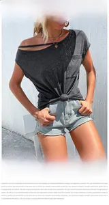 Detail of charcoal grey off-shoulder top with stylish front knot and irregular cutout design