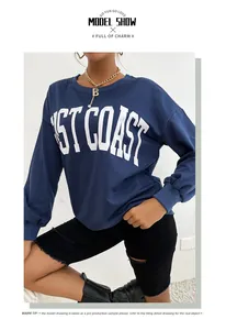 Detail of navy blue crew neck sweatshirt with bold white West Coast letter printing