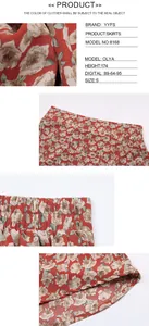 Detail view of red floral ruffle skirt showing fabric texture, elastic waist and hem