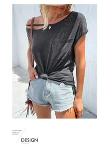 Detail of grey asymmetric cold shoulder T-shirt with cutout neck and knot hem decoration