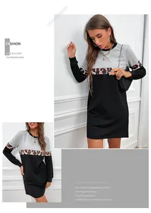 Detail of long sleeve dress featuring gray fabric with leopard print and black panels