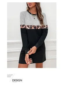 Detail of long sleeve patchwork dress featuring leopard print and ribbed cuffs