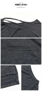 Detail of dark grey knit top showing lace-up neckline and fine stitching textures