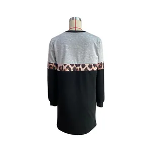 Detail view of the tricolor patchwork back on this casual long-sleeve sweatshirt dress