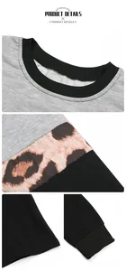 Detail of color-block sweatshirt featuring leopard print panels and ribbed crewneck