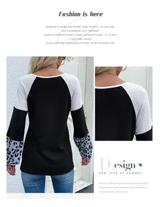 Detail of waffle knit fabric and leopard print color block sleeve on a casual sweater