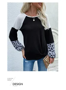 Detail showing waffle knit texture and leopard print patchwork on long sleeves