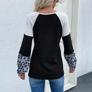 Women's waffle knit pullover with color block design and leopard print long sleeves