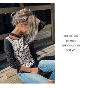 Detail of hollow-out neckline and leopard print patchwork on long-sleeved casual knit top
