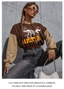 Close-up of skeleton print and expert lettering on the cropped color-block hoodie