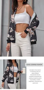 Detail of floral bomber jacket with ribbed cuffs and white flowers on black fabric