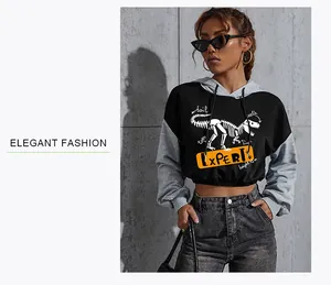 Detail of cropped color-block hoodie with dinosaur skeleton print and adjustable drawstring