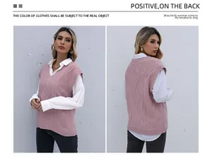 Detailed knit pattern of a pink V-neck vest layered over a white shirt and black pants