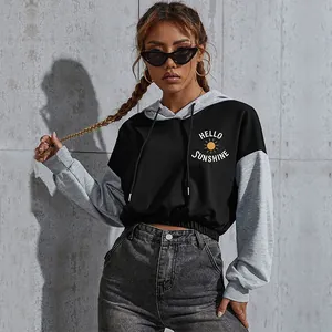 Detail of cropped color block hoodie with Hello Sunshine print and drawstring hood