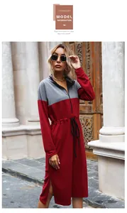 Detail view of contrast stitching, waist drawstring, and side slit on the midi dress
