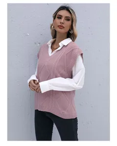 Detail of V-neck cable knit sweater vest in dusty rose with intricate texture patterns