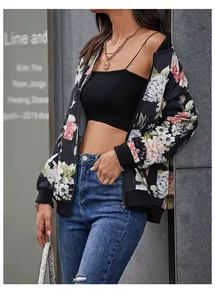Detail of floral print baseball jacket with ribbed cuffs and smooth zipper closure