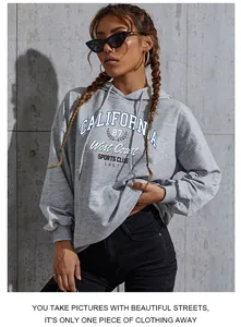 Detail of grey CALIFORNIA letter print on a loose cotton drawstring hoodie