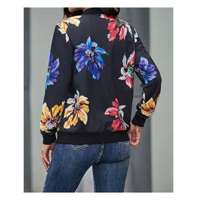 Detail view of the floral print pattern on the back of this women's black bomber jacket