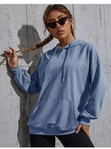 Close-up of oversized Morandi blue hoodie featuring a ribbed cuff and kangaroo pocket