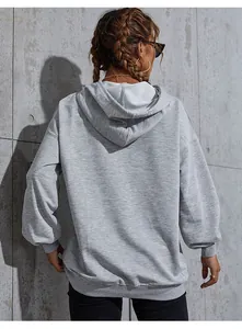 Detail view of the soft oversized fabric and ribbed cuffs on this gray drawstring hoodie