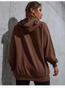 Back view of a brown oversized hoodie featuring dropped shoulders and ribbed cuffs