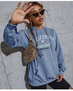 Detail of light blue hoodie featuring California 87 vintage print and kangaroo pocket