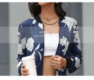 Detail of floral print bomber jacket with ribbed collar and front zipper closure