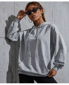 Detail of heather grey oversized hoodie featuring drop shoulders and kangaroo pocket