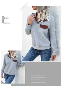 Detail of grey sweatshirt with contrast brown collar and textured jacquard fabric