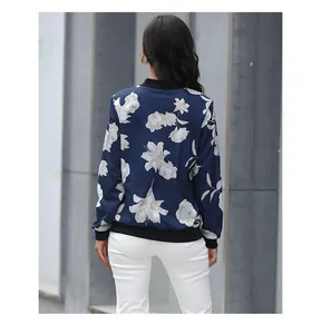 Detail of dark blue baseball jacket showing retro white floral print on the back