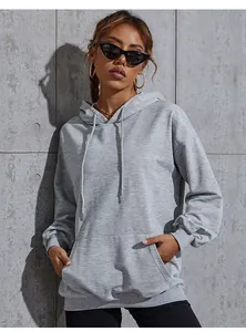 Close-up of grey oversized hoodie featuring dropped shoulders and a front kangaroo pocket
