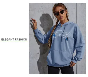 Detail of blue hoodie featuring DRIP letters and butterfly print with kangaroo pocket