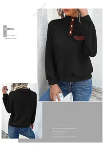 Detail of vintage quilted sweatshirt with brown stand collar and decorative metal buttons