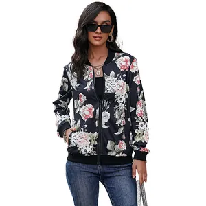 Women's floral bomber jacket in navy with pink blossoms and sleek zipper closure