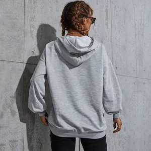 Light gray oversized hoodie for women featuring a relaxed drop shoulder design and hood