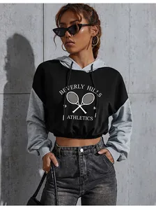 Close-up of Beverly Hills Athletics print on cropped grey and black color-block hoodie