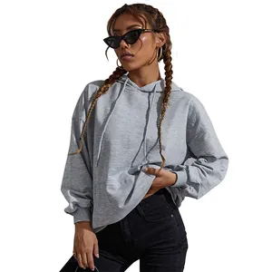 Oversized grey drawstring hoodie for women with a relaxed drop shoulder fit and street style