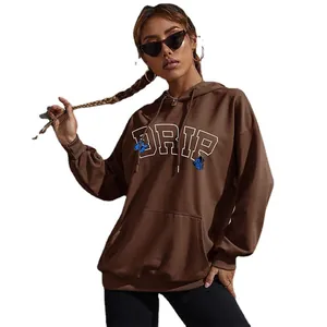 Oversized brown hoodie with blue butterfly prints and DRIP lettering for street style