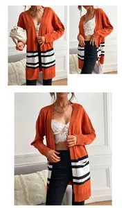 Detail showing bright orange knit cardigan with black and white horizontal stripe pattern