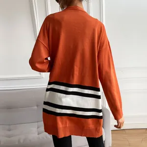 Women's orange knit cardigan with black and white horizontal stripes and long sleeves