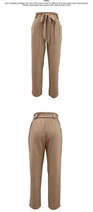 Detailweergave van kaki paperbag-broek met hoge taille, trekkoord en rechte pijpen