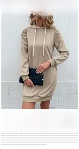 Detail of khaki long sleeve hooded sweatshirt dress featuring stylish puff sleeves