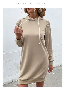 Detail of puffed sleeves and ribbed cuffs on khaki long-sleeve hooded sweatshirt dress