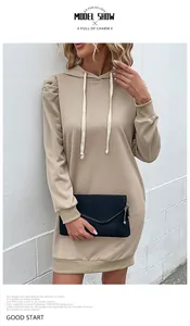 Detail of khaki drawstring hoodie dress featuring fashionable bubble sleeves and ribbed cuffs