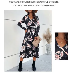 Detail of V-neck wrap dress with floral print and tie-waist on a long sleeve midi skirt