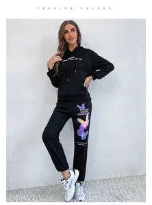Women's black tracksuit set with butterfly print hoodie and matching joggers detail