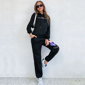 Women's 2-piece black tracksuit with hoodie and sweatpants featuring butterfly print