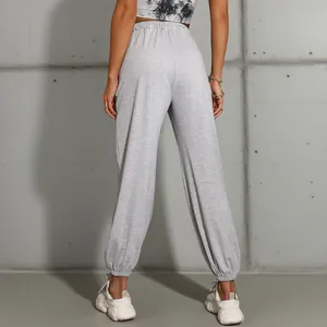 Women's high waist light grey jogger pants with elastic cuffs in an athletic style